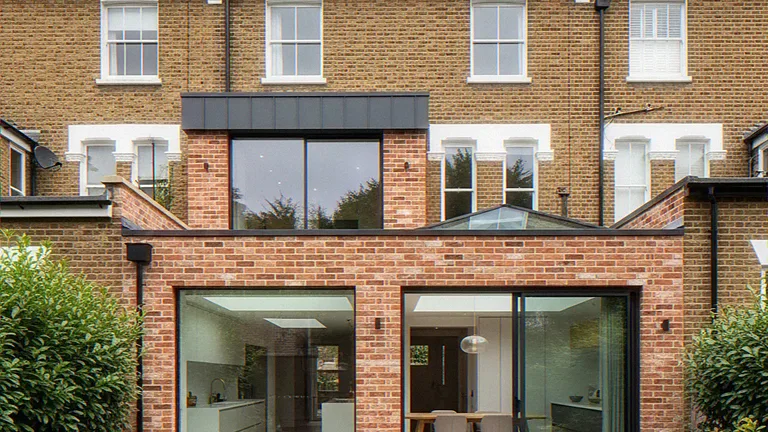 Exterior CGI of a red-brick single-storey rear extension with sliding glass doors