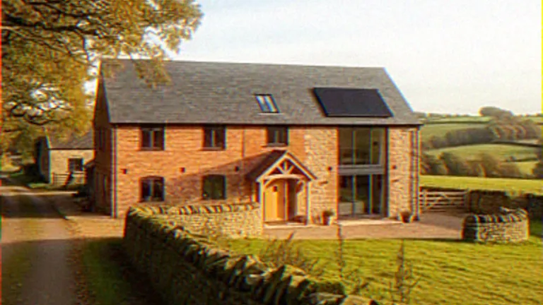Exterior CGI of a barn conversion with a timber gabled porch and rooftop solar panels
