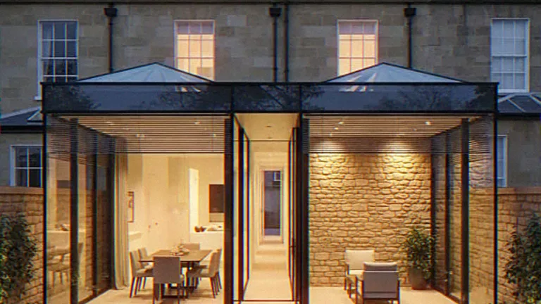 Exterior CGI of a twin-pitched glass box extension behind an ashlar stone house