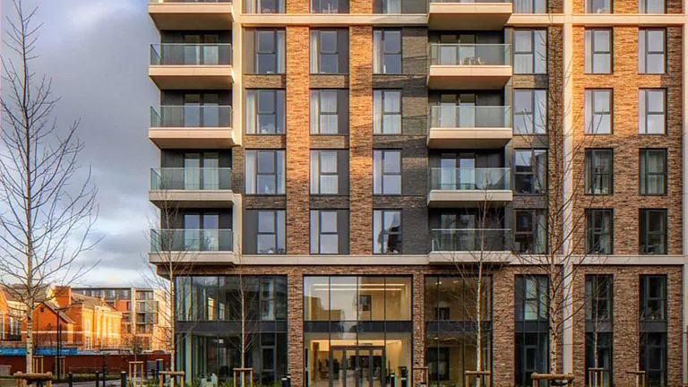 Exterior CGI of an apartment building with brick piers and glass balconies