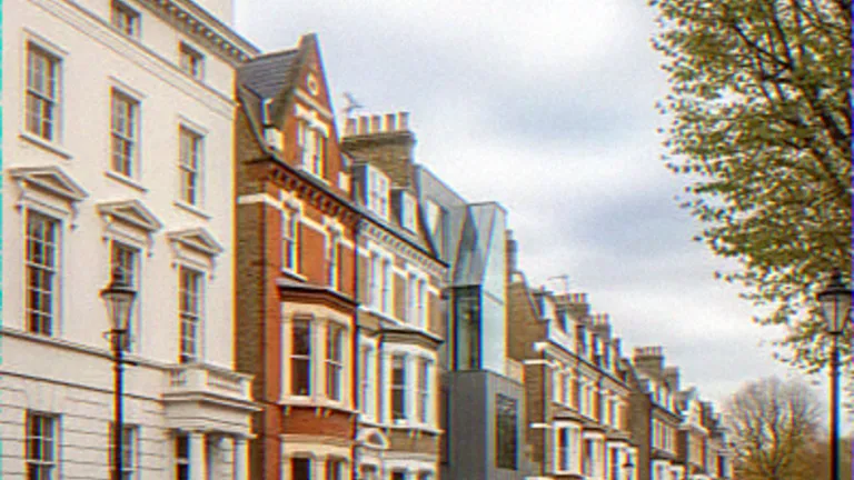 Exterior CGI of an angular zinc and glass infill house between period townhouses