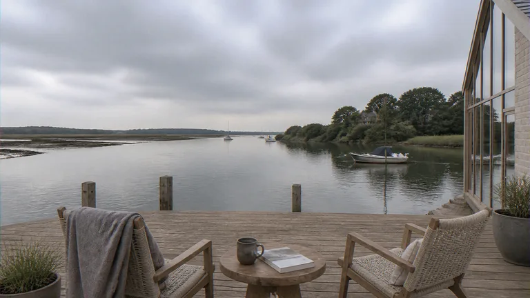 Waterfront CGI of the same quayside house looking from the flood deck toward the water
