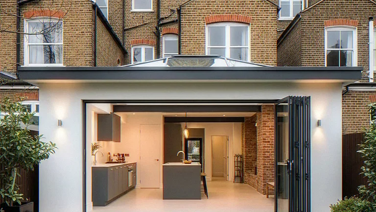 Exterior CGI of a rear extension with a glass roof lantern and an exposed steel beam